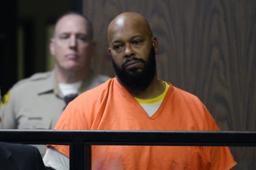 Rap mogul Suge Knight stands in court during his arraignment on murder charges at the Compton Courthouse in Compton