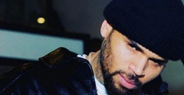 Chris Brown Criticized For Kissing Female Dancer on Stage